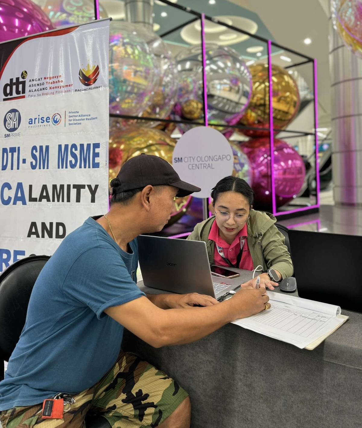 A local entrepreneur seeks business recovery guidance at SM City Olongapo Central.